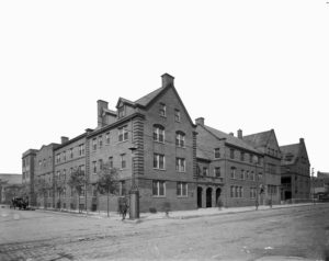Black and white photograph of the Hull House building, c. 1910
